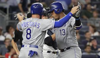 Kansas City Royals&#39; Salvador Perez (13) celebrates with Mike Moustakas (8) after hitting a two-run home run against the New York Yankees during the sixth inning of a baseball game Thursday, July 26, 2018, in New York. (AP Photo/Frank Franklin II)