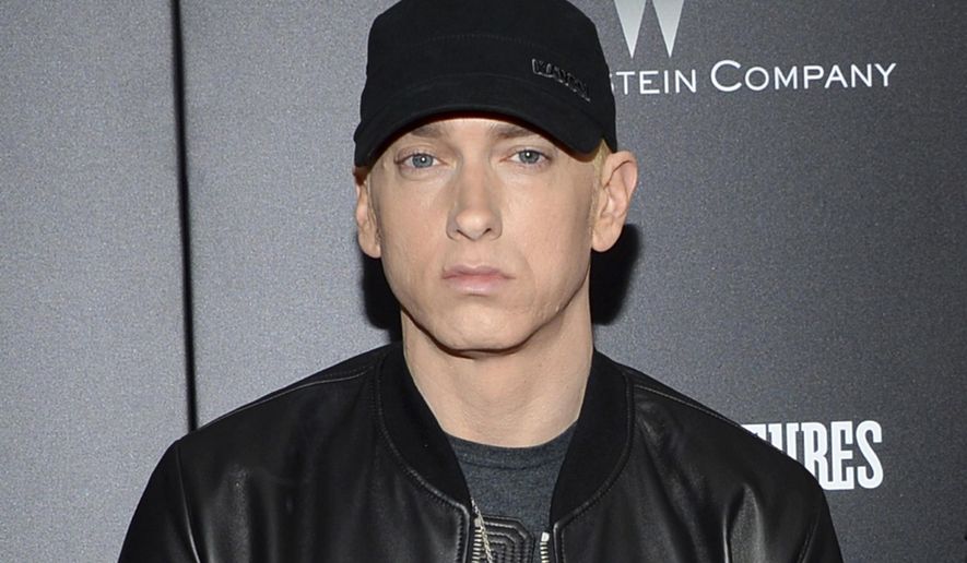 FILE - In this July 20, 2015, file photo, rapper Eminem attends the premiere of &amp;quot;Southpaw&amp;quot; in New York. Detroit-based fashion designer Clement Brown of the Three Thirteen shop is trying to block Eminem&#39;s trademark request for his apparel line, E13. Brown has held a trademark for his Three Thirteen brand since 2010, and the rapper born Marshall Mathers filed his pending request last year. (Photo by Evan Agostini/Invision/AP, File)