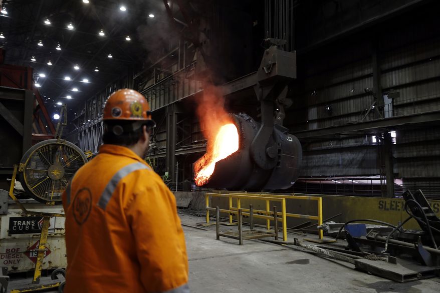 In this June 28, 2018 photo, senior melt operator Randy Feltmeyer watches a giant ladle as it backs away after pouring its contents of red-hot iron into a vessel in the basic oxygen furnace as part of the process of producing steel at the U.S. Steel Granite City Works facility in Granite City, Ill. President Donald Trump will visit the facility on Thursday, July 26, 2018. U.S. Steel credited Trump&#x27;s plan to impose tariffs on imported steel and aluminum when the company announced in March it was firing up a furnace at Granite City Works that had been idled for more than two years. (AP Photo/Jeff Roberson)