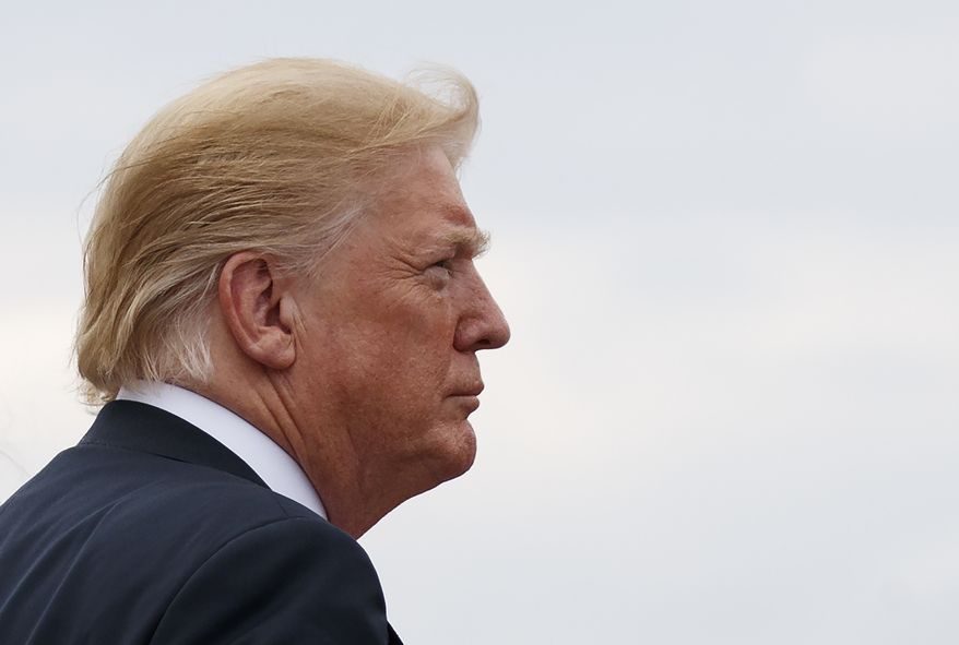 President Donald Trump boards Air Force One, Friday, July 27, 2018, in Andrews Air Force Base, Md., en route to Morristown Municipal Airport, in Morristown, N.J., and on to Trump National Golf Club in Bedminster, N.J. (AP Photo/Carolyn Kaster)