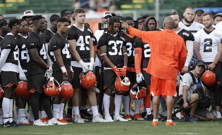Cleveland Browns head coach Hue Jackson, front right, talks with the team during NFL football training camp, Friday, July 27, 2018, in Berea, Ohio. (AP Photo/Tony Dejak)