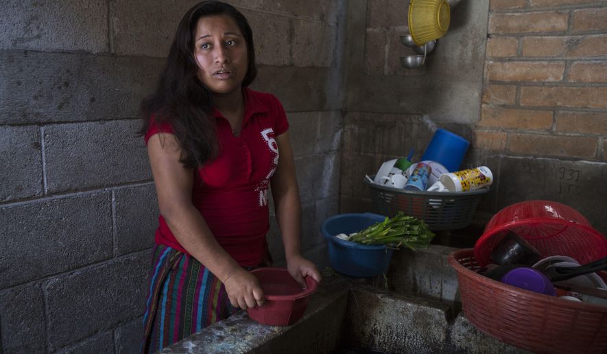 Paulina Gutierrez Alonzo, a 26-year-old Quiche indigenous woman, answers questions during an interview at her grandfather's house in Joyabaj, Guatemala, Thursday, July 26, 2018. Gutierrez Alonzo was deported from United States in June and separated from her 7-year-old daughter Antonia Yolanda Gomez Gutierrez, who is currently at an immigration center in Arizona, despite the Thursday deadline for reuniting children with their families who were caught entering the country without authorization. (AP Photo/Moises Castillo)