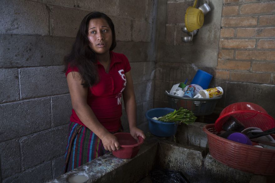 Paulina Gutierrez Alonzo, a 26-year-old Quiche indigenous woman, answers questions during an interview at her grandfather's house in Joyabaj, Guatemala, Thursday, July 26, 2018. Gutierrez Alonzo was deported from United States in June and separated from her 7-year-old daughter Antonia Yolanda Gomez Gutierrez, who is currently at an immigration center in Arizona, despite the Thursday deadline for reuniting children with their families who were caught entering the country without authorization. (AP Photo/Moises Castillo)