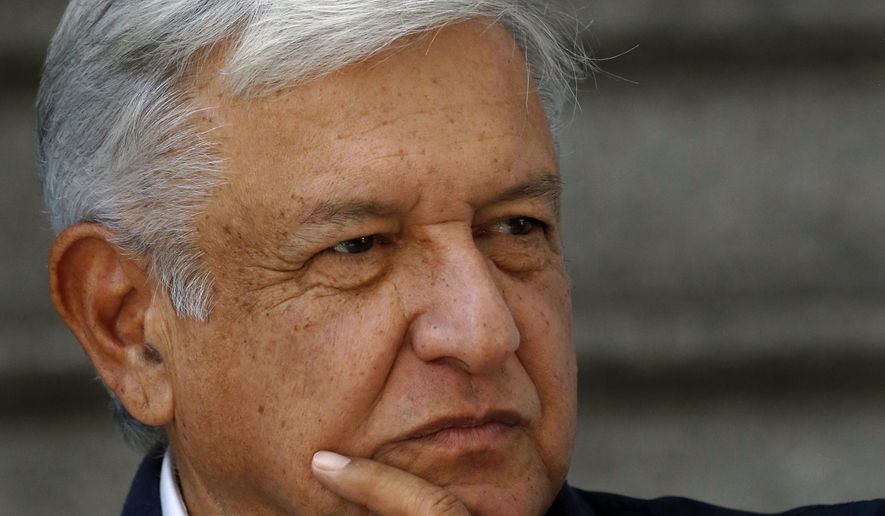 In this Sunday, July 22, 2018 photo, Mexico's President-elect Andres Manuel Lopez Obrador listens to a reporter's question outside his party's headquarters, in Mexico City. Lopez Obrador announced a $16 billion investment plan Friday, July 27, 2018, to boost flagging oil production, refinery capacity and electrical generation. (AP Photo/Marco Ugarte)