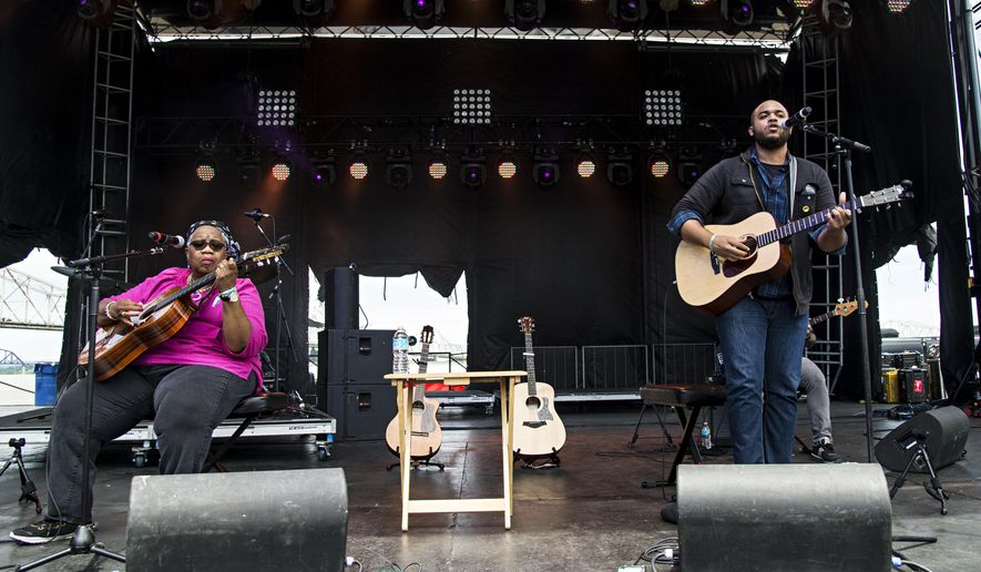 FILE - In this July 16, 2016 file photo, Ruth Ward, left, and Madisen Ward of Madisen Ward and the Mama Bear perform at the Forecastle Music Festival in Louisville, Ky. The mother-and-son duo Madisen Ward & the Mama Bear offer excellent songs on new six-song, folk-roots EP, “The Radio Winners.” (Photo by Amy Harris/Invision/AP, File)