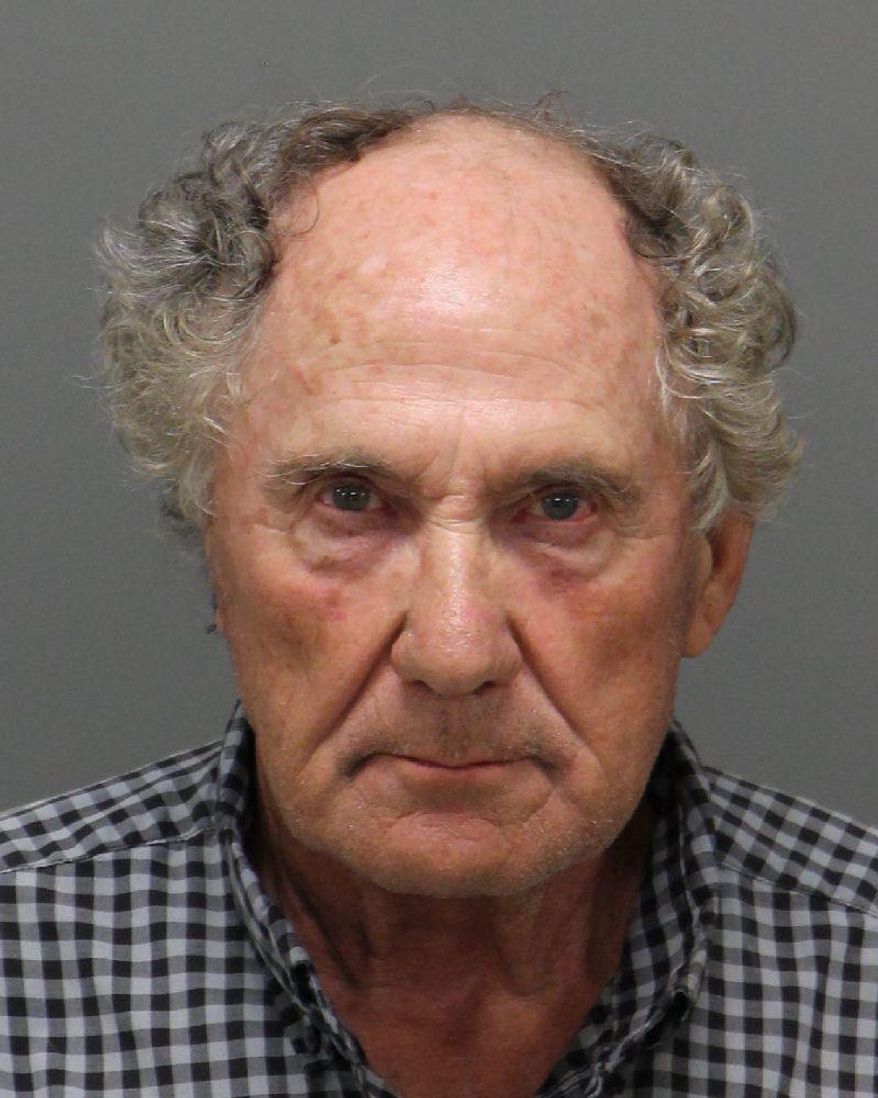 This undated photo courtesy of Wake City/County Bureau of Identification shows Charles Michael Hager, who was charged with assault with a deadly weapon and damaging property after authorities say he drove his car through a glass storefront at a Verizon Wireless store, Thursday, July 26, 2018 in Raleigh, N.C. A 911 caller says that Hager was complaining that his phone needed to be fixed and demanding that the store reopen. (Wake City/County Bureau of Identification via AP)