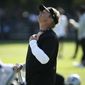 Oakland Raiders head coach Jon Gruden smiles watching his team stretch during NFL football practice in Napa, Calif., Friday, July 27, 2018. (AP Photo/Eric Risberg)