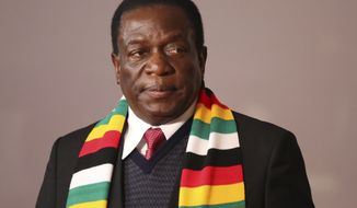Zimbabwe&#39;s President Emmerson Mnangagwa attends the BRICS Summit in Johannesburg, South Africa, Friday, July 27, 2018. Zimbabwe goes to the polls Monday after Mnanngagwa became president After Robert Mugabe resigned in November last year. (Mike Hutchings/Pool Photo via AP)