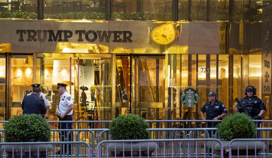 Police investigate the report of a "suspicious item" inside Trump Tower on Fifth Avenue, Friday, July 27, 2018, in New York. Police say suspicious items have been determined to be harmless. (AP Photo/Craig Ruttle)
