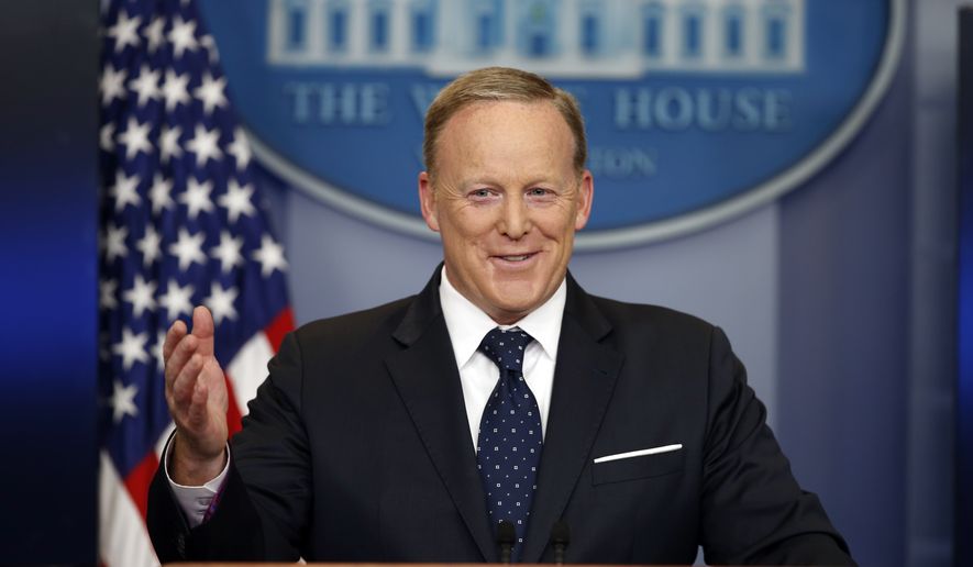 In this Tuesday, June 20, 2017, file photo, then-White House press secretary Sean Spicer smiles as he answers a question during a briefing at the White House in Washington. (Associated Press) **FILE**