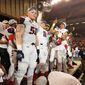 Washington Valor backup quarterback Warren Smith (No. 8) holds the Foster Trophy and celebrates with Jimmy Gordon (No. 50) and other teammates after the Valor beat the Baltimore Brigade 69-55 in ArenaBowl XXXI at Royal Farms Arena in Baltimore on Saturday, July 28, 2018. (Photo by Adam Zielonka/The Washington Times)