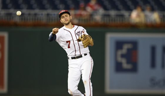 Washington Nationals shortstop Trea Turner (7) throws to first during a baseball game against the Atlanta Braves, Sunday, July 22, 2018, in Washington. The Nationals won 6-2.(AP Photo/Nick Wass) ** FILE **