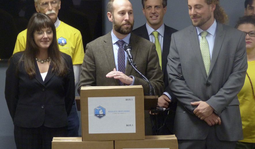 Josh Hovey, spokesman for the Coalition to Regulate Marijuana Like Alcohol, speaks at a news conference in Lansing, Mich., where group submitted more than 360,000 signatures for a 2018 ballot drive to legalize the use of marijuana for recreational purposes. A proposal to legalize marijuana has sprouted on Michigan's November ballot, putting the state on the cusp of allowing recreational use of the drug for those 21 and older. It could also entice younger voters to show up to the polls, which could help the Democrats. (AP Photo/David Eggert, File)
