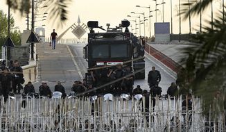 Iraqi riot police close a bridge leading to the heavily guarded Green Zone during protests demanding services and jobs in central Baghdad, Iraq, Friday, July 27, 2018. (AP Photo/Hadi Mizban) **FILE**