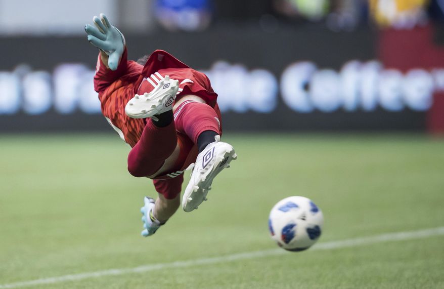 Minnesota United goalkeeper Bobby Shuttleworth allows a goal to Vancouver Whitecaps' Yordy Reyna during the first half of an MLS soccer match Saturday, July 28, 2018, in Vancouver, British Columbia. (Darryl Dyck/The Canadian Press via AP)