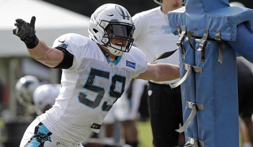 Carolina Panthers' Luke Kuechly (59) runs a drill during an NFL football practice at the team's training camp in Spartanburg, S.C., Sunday, July 29, 2018. (AP Photo/Chuck Burton)