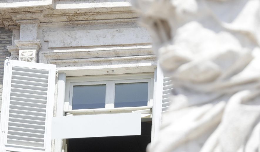 Pope Francis delivers his message from his studio window overlooking St. Peter's Square during the Angelus noon prayer at the Vatican, Sunday, July 29, 2018. (AP Photo/Gregorio Borgia)
