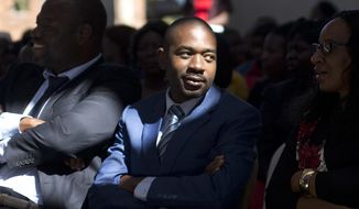 Zimbabwe opposition challenger Nelson Chamisa participates in a Sunday church service in Harare, Zimbabwe, Sunday July 29, 2018. Zimbabwe votes Monday in an election that could, if deemed credible, tilt the country toward recovery after years of economic collapse and repression under former leader Robert Mugabe. (AP Photo/Jerome Delay)