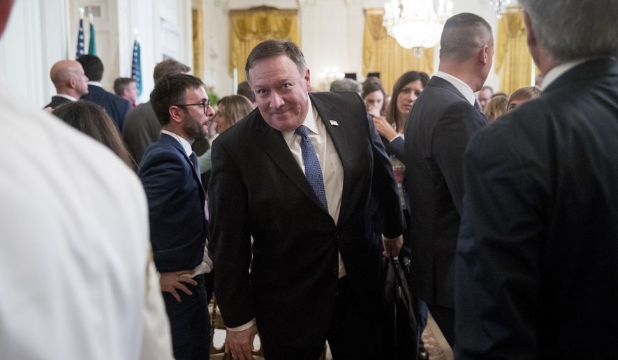 Secretary of State Mike Pompeo, center, departs a news conference with President Donald Trump and Italian Prime Minister Giuseppe Conte in the East Room of the White House, Monday, July 30, 2018, in Washington. (AP Photo/Andrew Harnik)