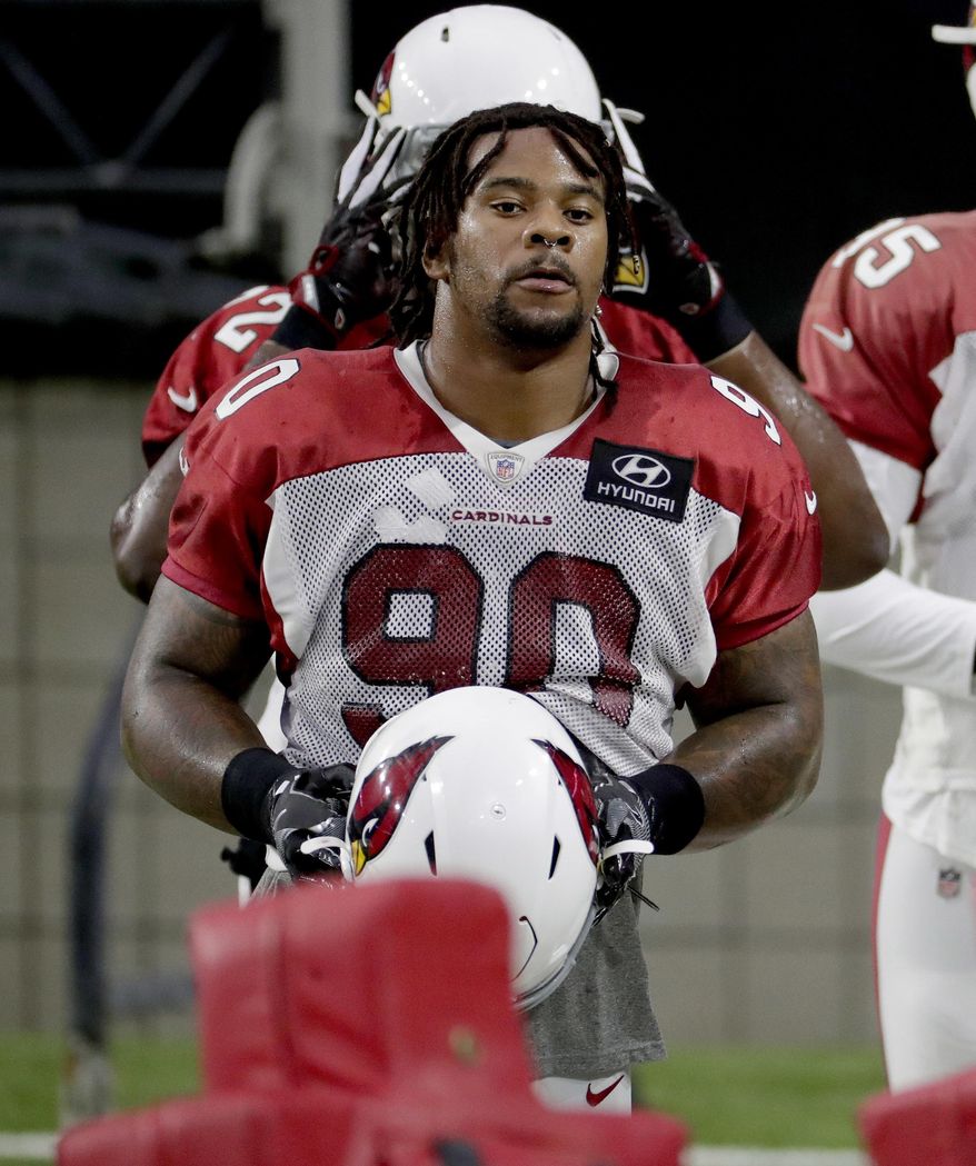 Arizona Cardinals defensive tackle Robert Nkemdiche (90) takes the field during an NFL football practice, Monday, July 30, 2018, in Glendale, Ariz. (AP Photo/Matt York)