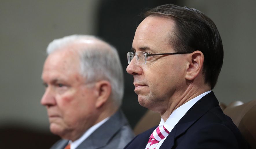 Attorney General Jeff Sessions, left, and Deputy Attorney General Rod Rosenstein, listen to remarks during a Religious Liberty Summit at the Department of Justice, Monday, July 30, 2018. (AP Photo/Manuel Balce Ceneta)