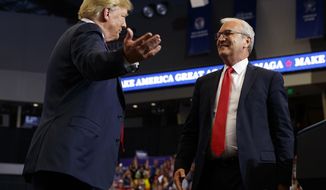 FILE - In this June 27, 2018, file photo President Donald Trump hugs Senate candidate Rep. Kevin Cramer, R-N.D., during a campaign rally in Fargo, N.D. The conservative Koch brothers&#39; network declared July 30, that it will not help elect Cramer, the Republican Senate candidate in North Dakota, turning its back on the GOP in a marquee election — at least for now — after determining that the Republican challenger is no better than the Democratic incumbent Heidi Heitkamp.(AP Photo/Evan Vucci, File)