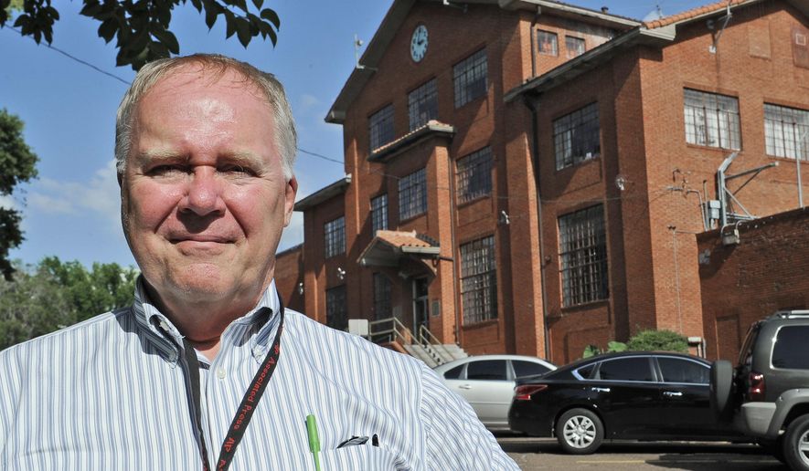 In this June 12, 2013, file photo, Associated Press reporter Michael Graczyk stands outside the Huntsville Unit before witnessing the execution of confessed killer Elroy Chester in Huntsville, Texas. Graczyk, who witnessed and chronicled more than 400 executions as a criminal justice reporter in Texas, will retire Tuesday, July 31, 2018, after 45 years. (AP Photo/Pat Sullivan, File)