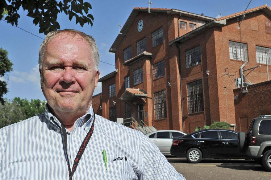 In this June 12, 2013, file photo, Associated Press reporter Michael Graczyk stands outside the Huntsville Unit before witnessing the execution of confessed killer Elroy Chester in Huntsville, Texas. Graczyk, who witnessed and chronicled more than 400 executions as a criminal justice reporter in Texas, will retire Tuesday, July 31, 2018, after 45 years. (AP Photo/Pat Sullivan, File)