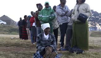 Zimbabweans queue to vote in Harare, Zimbabwe, at the start of the country&#39;s elections Monday, July 30, 2018. Zimbabweans are voting in their first election without Robert Mugabe on the ballot, a contest that could open the way toward international legitimacy or signal more stagnation if the vote is seriously flawed. (AP Photo/Shepherd Tozvireva)