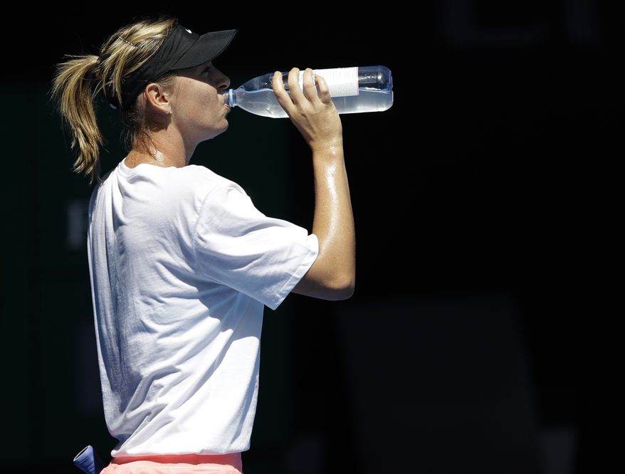 Russia&#39;s Maria Sharapova takes a drink of water during a practice session ahead of the Australian Open tennis championships in Melbourne, Australia, Sunday, Jan. 14, 2018. (AP Photo/Dita Alangkara) **FILE**

