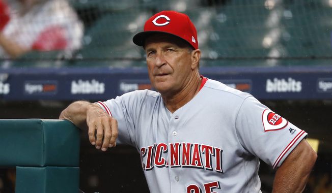 Cincinnati Reds interim manager Jim Riggleman watches from the dugout during the first inning of the team&#x27;s baseball game against the Detroit Tigers in Detroit, Tuesday, July 31, 2018. (AP Photo/Paul Sancya) **FILE**