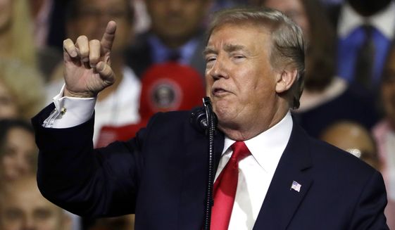 President Donald Trump gestures during a rally Tuesday, July 31, 2018, in Tampa, Fla. (AP Photo/Chris O&#39;Meara)