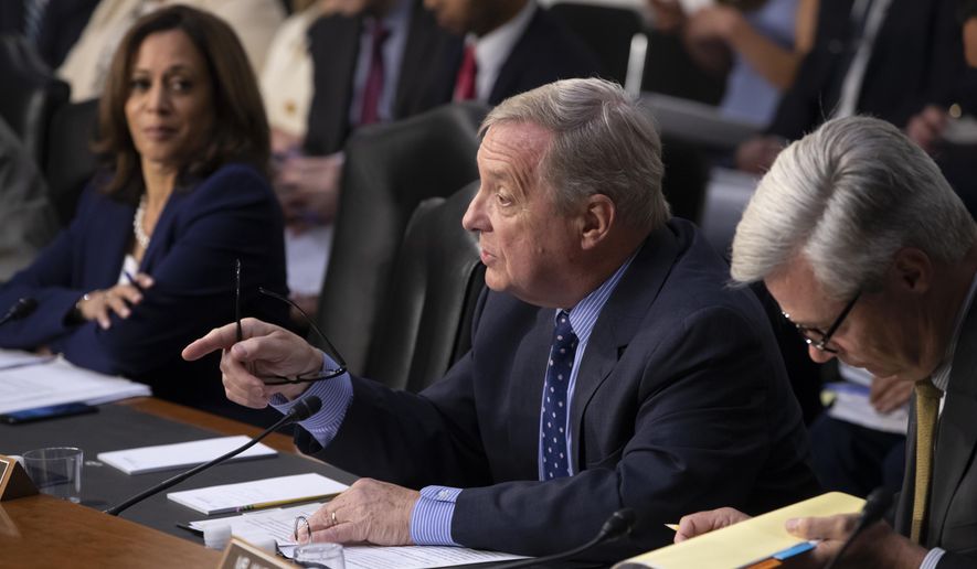 Sen. Dick Durbin, D-Ill., flanked by Sen. Kamala Harris, D-Calif., left, and Sen. Sheldon Whitehouse, D-R.I., questions witnesses as the Senate Judiciary Committee holds a hearing on the Trump administration&#x27;s policies on immigration enforcement and family reunification efforts, on Capitol Hill in Washington, Tuesday, July 31, 2018. (AP Photo/J. Scott Applewhite)