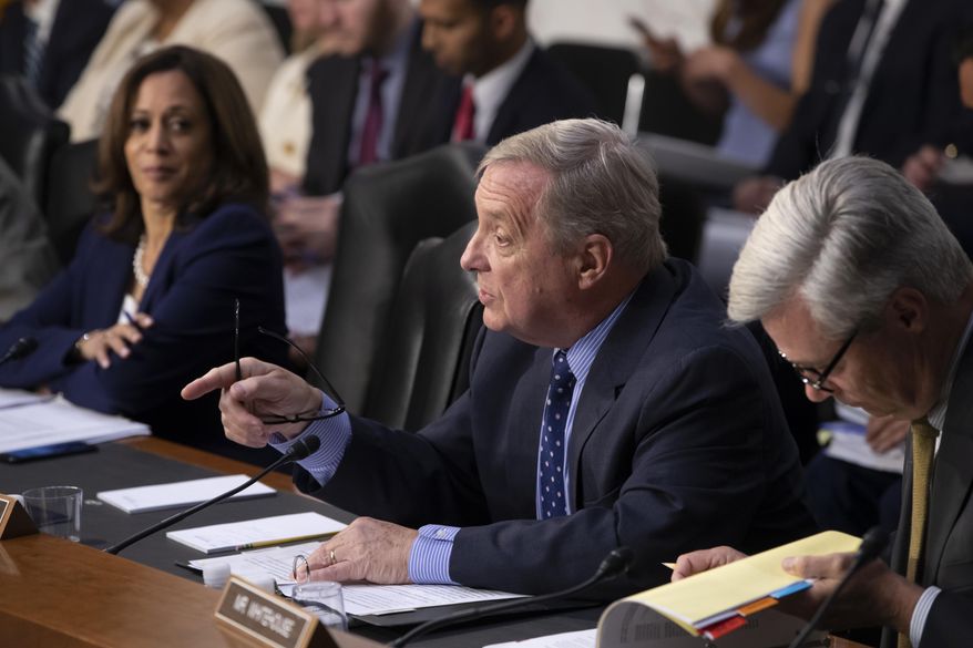 Sen. Dick Durbin, D-Ill., flanked by Sen. Kamala Harris, D-Calif., left, and Sen. Sheldon Whitehouse, D-R.I., questions witnesses as the Senate Judiciary Committee holds a hearing on the Trump administration&#x27;s policies on immigration enforcement and family reunification efforts, on Capitol Hill in Washington, Tuesday, July 31, 2018. (AP Photo/J. Scott Applewhite)