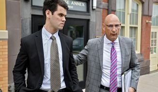 FILE – In this June 13, 2018, file photo, Ryan Burke, left, who was a fraternity brother at Penn State University&#39;s shuttered Beta Theta Pi chapter, walks with his attorney Philip Masorti on the day Burke pleaded guilty to four counts of hazing and five alcohol-related offenses related to the death of 19-year-old fraternity pledge Timothy Piazza, of Lebanon, N.J., outside the Centre County Courthouse Annex in Bellefonte, Pa. Burke is set to learn his sentence, on Tuesday, July 31. (Abby Drey/Centre Daily Times via AP, File)