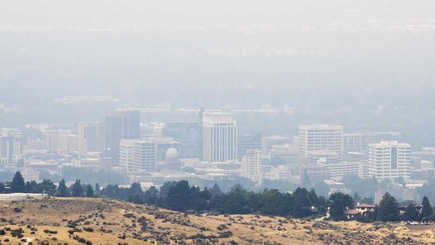 Smoke from Western wildfires thickens the skies above Boise Tuesday, July 31, 2018. (Darin Oswald/Idaho Statesman via AP)