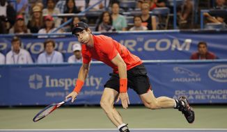 Andy Murray of Britain chases a ball to return against Mackenzie McDonald during the first round of the Citi Open tennis tournament, Monday, July 30, 2018, in Washington. (AP Photo/Carolyn Kaster)