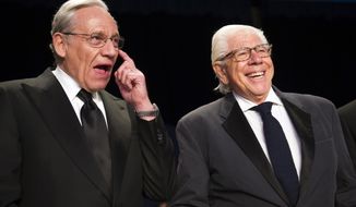 FILE - In this April 29, 2017 file photo, Bob Woodward, left, and Carl Bernstein appear at the White House Correspondents&#x27; Dinner in Washington. More than 40 years after they became the world’s most famous journalism duo, Bob Woodward and Carl Bernstein are still making news. Bernstein was among three CNN reporters who last week broke the story of former Donald Trump lawyer Michael Cohen’s allegation that Trump had advance knowledge of the June 2016 meeting between representatives of his campaign and Russian officials. On Tuesday, July 31, 2018, Woodward’s upcoming “Fear: Inside the Trump White House” was No. 1 on Amazon.com.  (AP Photo/Cliff Owen, File)