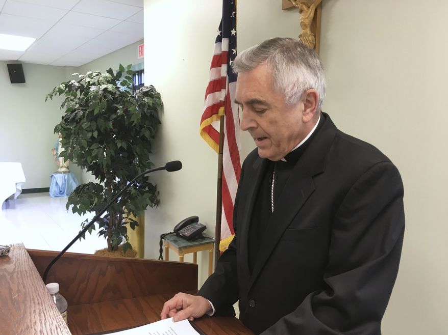 The Most Rev. Ronald Gainer, the Roman Catholic bishop of the diocese of Harrisburg, Pa., discusses child sexual abuse by clergy and a decision by the diocese to remove names of bishops going back to the 1940s after concluding they did not respond adequately to abuse allegations, during a Wednesday, Aug. 1, 2018, news conference in Harrisburg, Pa. The bishop apologized to victims and said the diocese is posting an online list of 71 priests and others in the church accused of the abuse. Following the Erie, Pa., diocese, the Harrisburg diocese is the second Pennsylvania diocese to get ahead of a roughly 900-page grand jury report that could be made public in August 2018, which the Pennsylvania Supreme Court said found more than 300 "predator priests" in six of the state's eight dioceses. (AP Photo/Mark Scolforo)