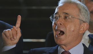 Former Colombian President and Sen. Alvaro Uribe speaks during a press conference at his home in Rionegro, Colombia, Monday, July 30, 2018, a week after Colombia&#39;s Supreme Court ordered him to testify on allegations of witness tampering. Uribe gave a detailed explanation in refuting the accusations against him. (AP Photo/Luis Benavides)
