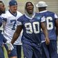 FILE - In this July 27, 2018, file photo, Dallas Cowboys defensive end Demarcus Lawrence (90) reacts during NFL football training camp in Oxnard, Calif. Lawrence had the second-best sack total in the NFL last year. (AP Photo/Gus Ruelas, File)