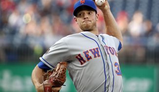 New York Mets starting pitcher Steven Matz throws during the first inning of the team&#39;s baseball game against the Washington Nationals at Nationals Park, Tuesday, July 31, 2018, in Washington. (AP Photo/Alex Brandon)