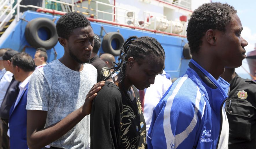 Migrants arrive at a the southern port of Zarzis, Tunisia, Wednesday, Aug. 1, 2018. Tunisian Prime Minister Youssef Chahed said he is allowing 40 migrants who have been kept at sea for two weeks to enter Tunisia "for humanitarian reasons." The migrants reportedly were stranded in the Mediterranean Sea for five days before a Maltese ship picked them up and then transferred them to the Tunisian-flagged commercial boat on July 16. Italy, Malta and France all refused to let the vessel into their ports. (AP Photo/Mounir Beji)
