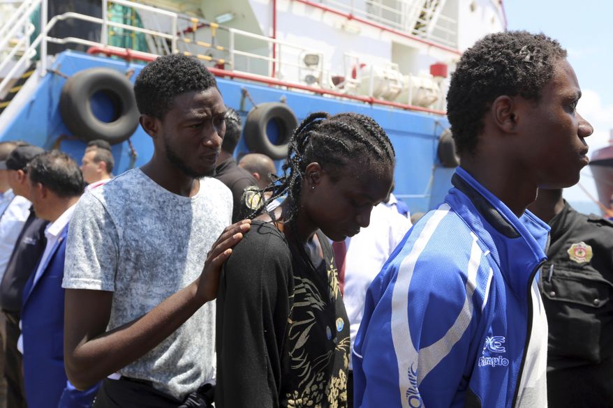 Migrants arrive at a the southern port of Zarzis, Tunisia, Wednesday, Aug. 1, 2018. Tunisian Prime Minister Youssef Chahed said he is allowing 40 migrants who have been kept at sea for two weeks to enter Tunisia "for humanitarian reasons." The migrants reportedly were stranded in the Mediterranean Sea for five days before a Maltese ship picked them up and then transferred them to the Tunisian-flagged commercial boat on July 16. Italy, Malta and France all refused to let the vessel into their ports. (AP Photo/Mounir Beji)