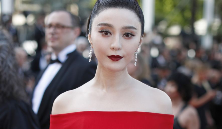 FILE - In this May 24, 2017, file photo, Fan Bingbing poses for photographers as she arrives for the screening of the film The Beguiled at the 70th international film festival, Cannes, southern France. Chinese actress Fan has disappeared from social media amid rumors she is the target of a tax evasion investigation and that she, her brother and boyfriend have been barred from leaving China. (AP Photo/Thibault Camus, File)