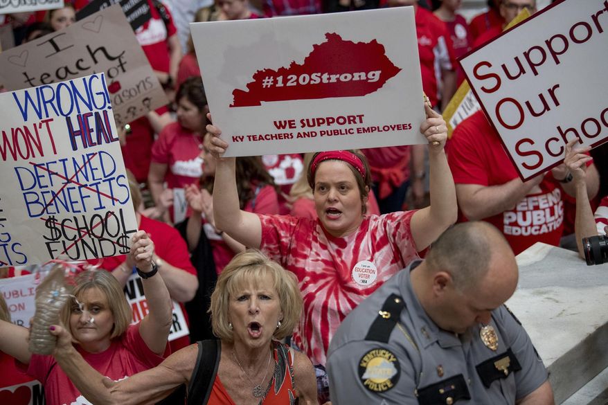 This April 13, 2018 file photo shows teachers from across Kentucky at the state Capitol to rally for increased funding and to protest changes to their state funded pension system,in Frankfort, Ky. Some teachers in Kentucky plan to use a popular political picnic to launch a Fall offensive on the midterm elections. Leaders of the group #120Strong say they expect as many as 200 people to attend the Fancy Farm picnic on Saturday, Aug. 4, 2018. (AP Photo/Bryan Woolston, File)