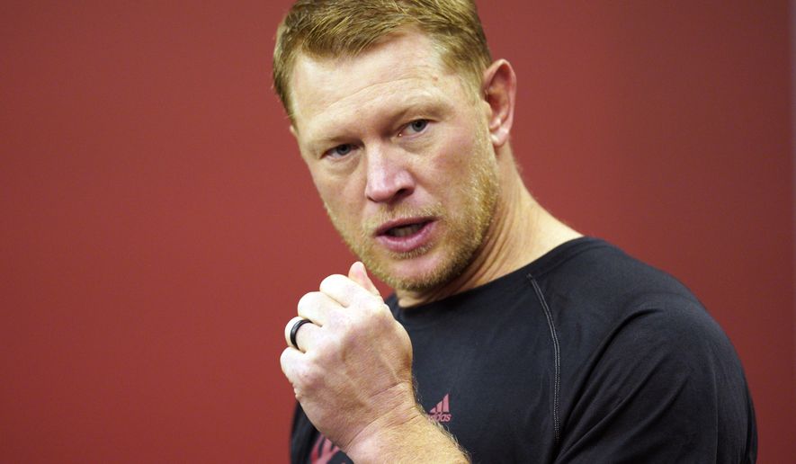 Nebraska head coach Scott Frost speaks during an NCAA college football news conference in Lincoln, Neb., Thursday, Aug. 2, 2018. Frost has said repeatedly that Nebraska made a mistake moving away from the methods Osborne successfully used. Frost's job is to return his team to the place it held in the college football hierarchy two decades ago by returning to the methods Osborne used on and off the field to make the Cornhuskers great. 2018. (AP Photo/Nati Harnik)