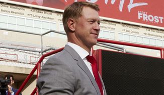 In this Dec. 3, 2017, photo, Nebraska NCAA college football head coach Scott Frost poses for a photo at Memorial Stadium in Lincoln, Neb. Frost has said repeatedly that Nebraska made a mistake moving away from the methods former coach Tom Osborne successfully used. Frost&#39;s job is to return his team to the place it held in the college football hierarchy two decades ago by returning to the methods Osborne used on and off the field to make the Cornhuskers great. (AP Photo/Nati Harnik)