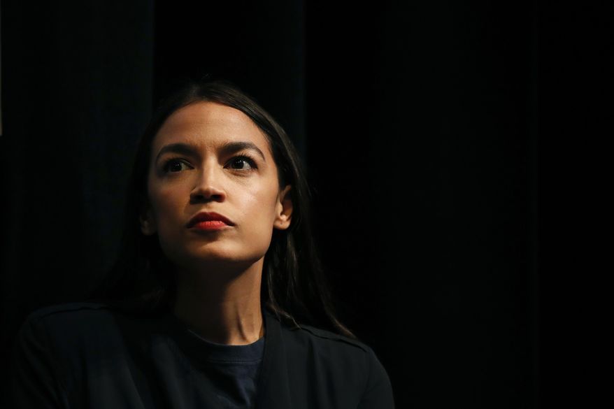 New York congressional candidate Alexandria Ocasio-Cortez listens to a speaker at a fundraiser Thursday, Aug. 2, 2018, in Los Angeles. The 28-year-old startled the party when she defeated 10-term U.S. Rep. Joe Crowley in a New York City Democratic primary. Ocasio-Cortez is a rising liberal star who is challenging the Democratic Party establishment. (AP Photo/Jae C. Hong) ** FILE **