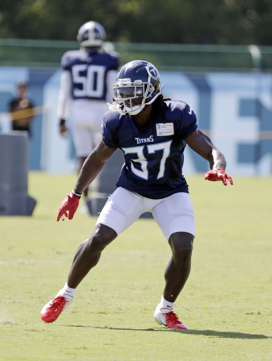 FILE - In this July 29, 2018, file photo, Tennessee Titans defensive back Johnathan Cyprien runs a drill during NFL football training camp in Nashville, Tenn. Cyprien will miss the season with a torn left ACL, and coach Mike Vrabel says veteran Eric Reid is among the safeties the Titans want to look at for a potential replacement. Cyprien left practice Wednesday, Aug. 1, 2018, after grabbing at his left knee. (AP Photo/Mark Humphrey, File)